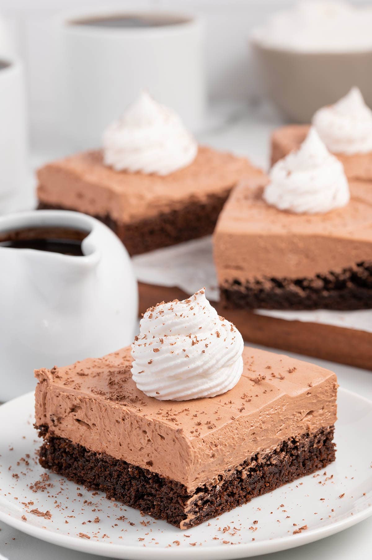 French Silk Brownies with a dollop of whipped cream on top.