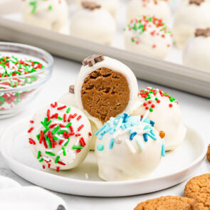 a couple of Gingerbread Truffles on a white plate with sprinkles.