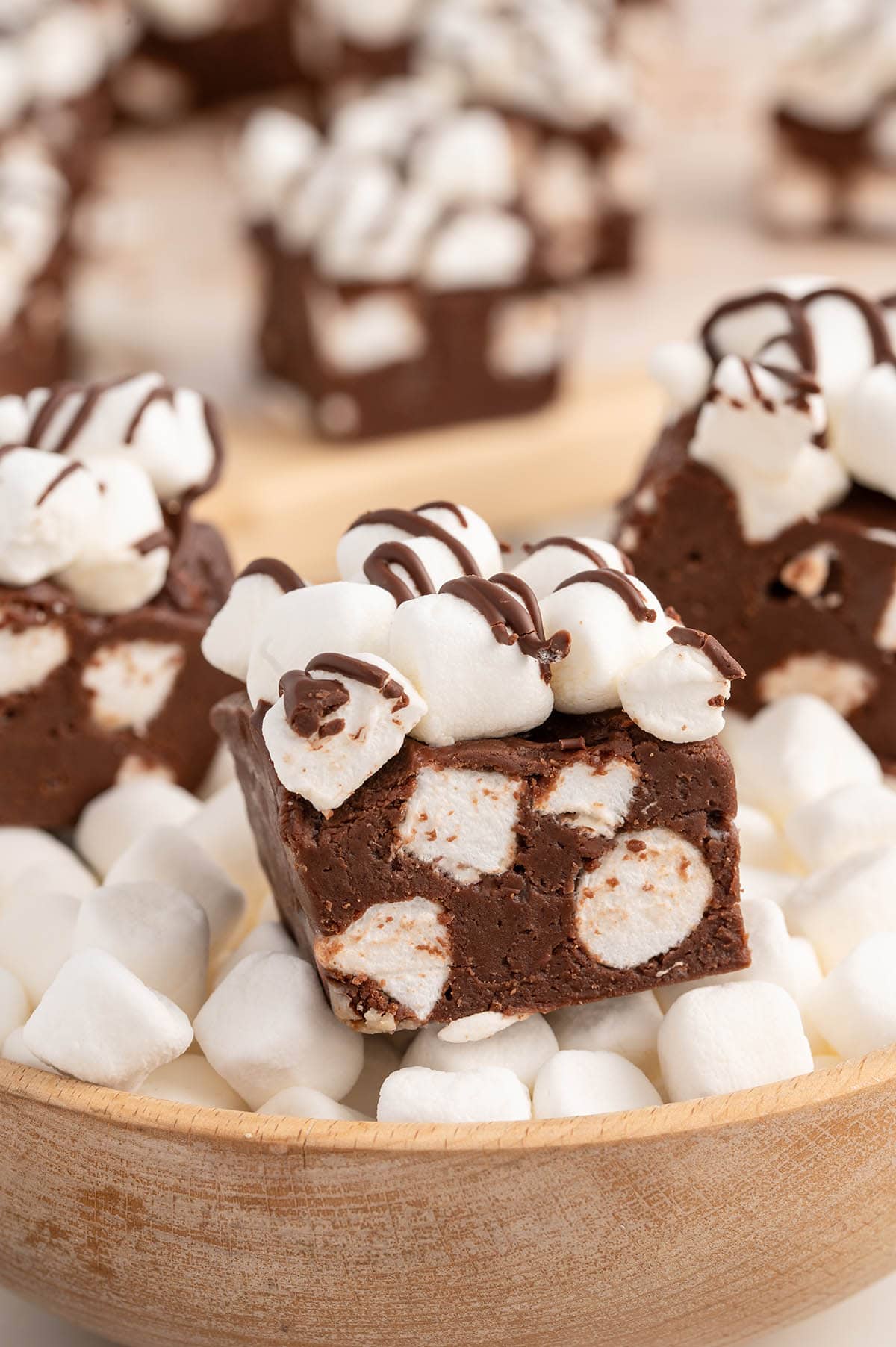 hot chocolate fudge in a bowl of mini marshmallows.