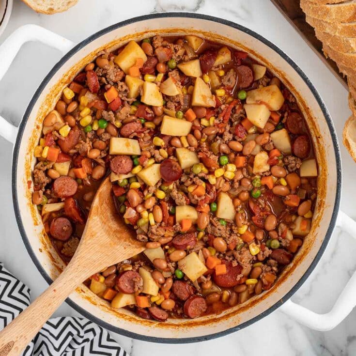 Hearty Texas Cowboy Stew features potatoes, carrots, corn, and mixed beans.