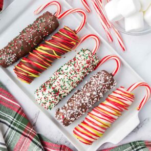 Christmas Marshmallow Pops on a white plate.