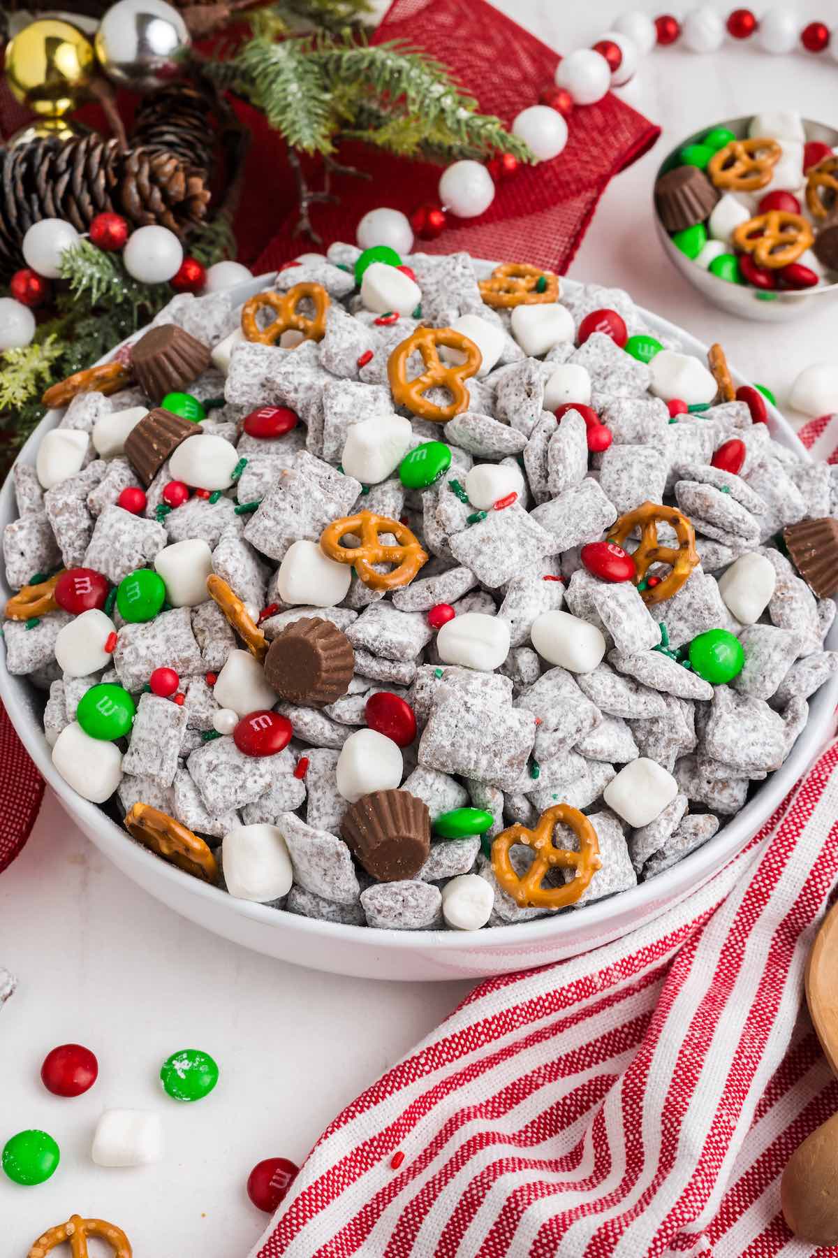 Christmas Puppy Chow on a white table.