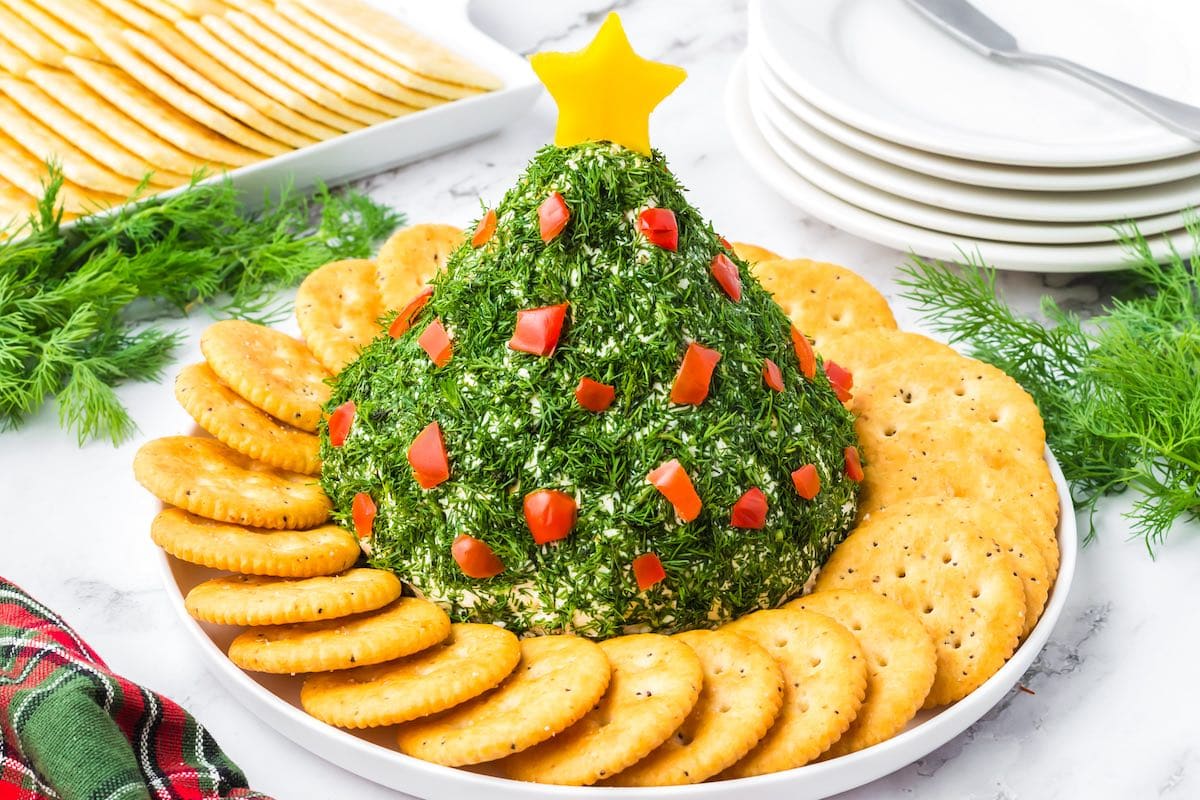 Christmas Tree Cheese Ball with a star on top surrounded with crackers.