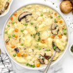 Gnocchi Chicken Pot Pie in a bowl on a white table.