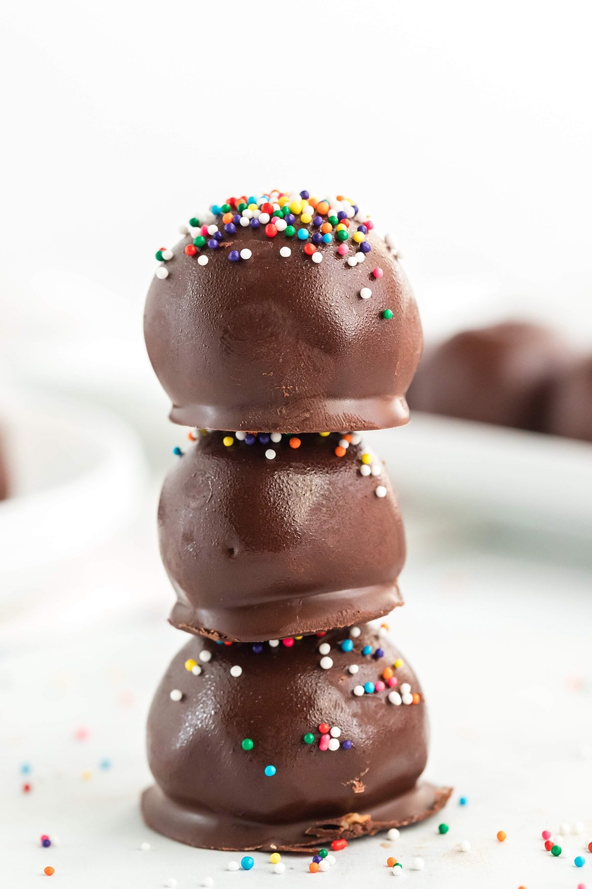 stacked peanut butter balls with rainbow sprinkles