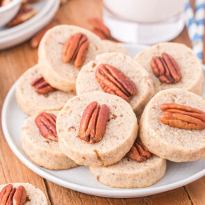a couple of Pecan Sandies on a white table.
