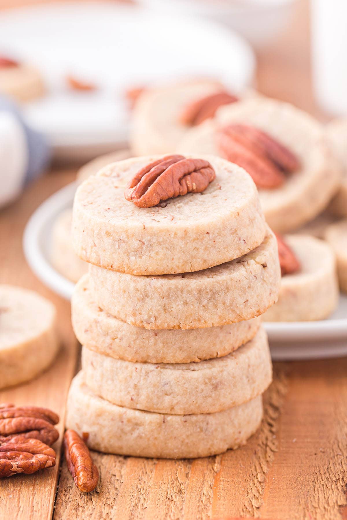 Pecan Sandies stacked on the table.