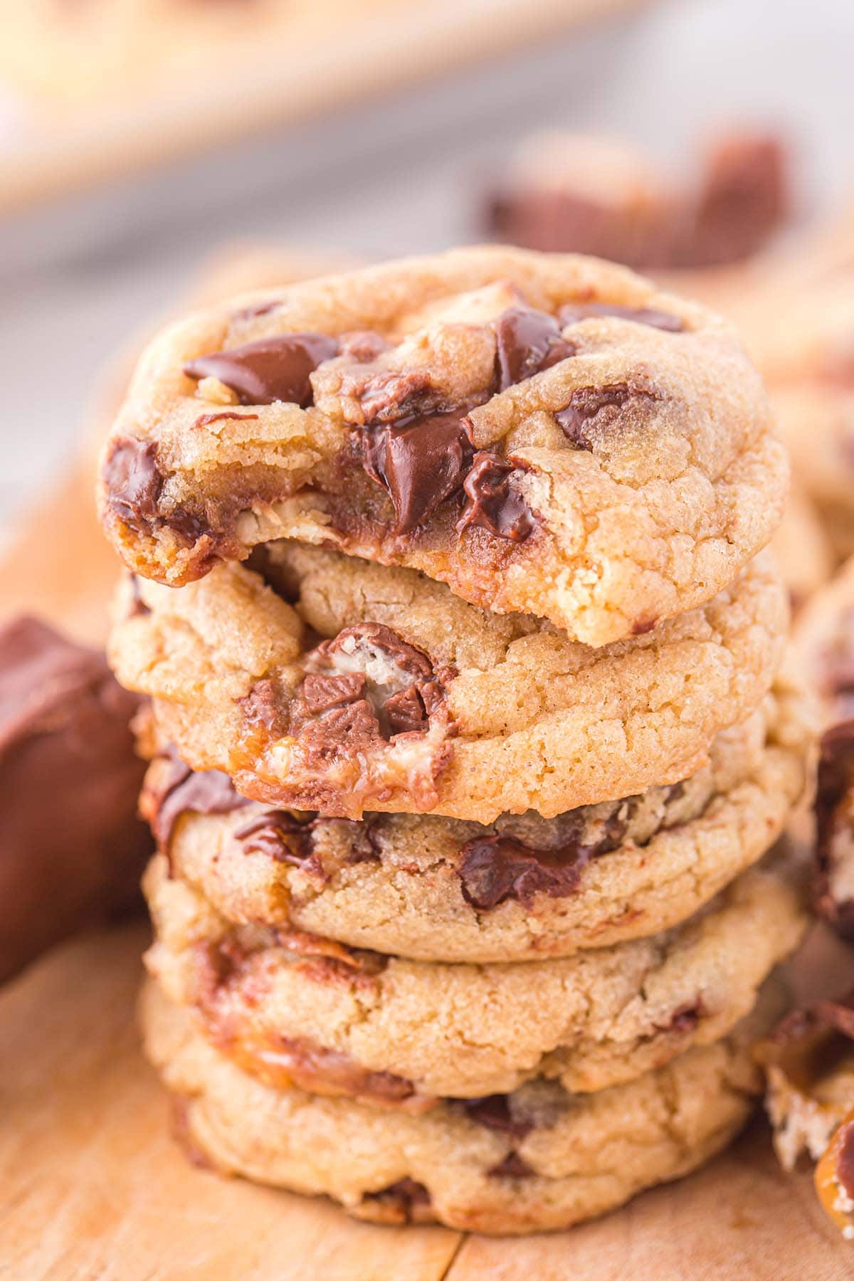 bitten snicker cookies stacked on top of other cookies.