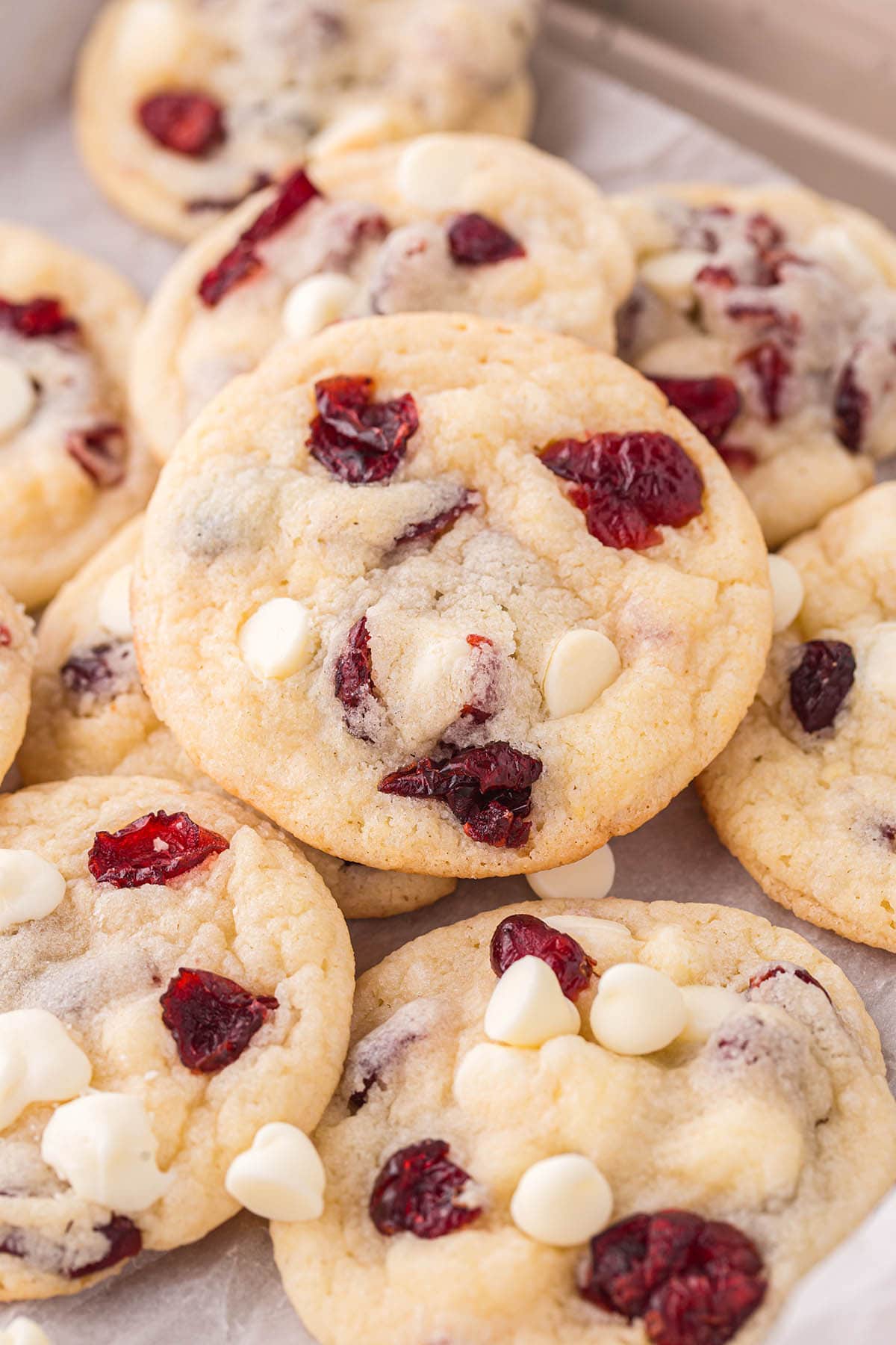 a couple White Chocolate Cranberry Cookies on the table.