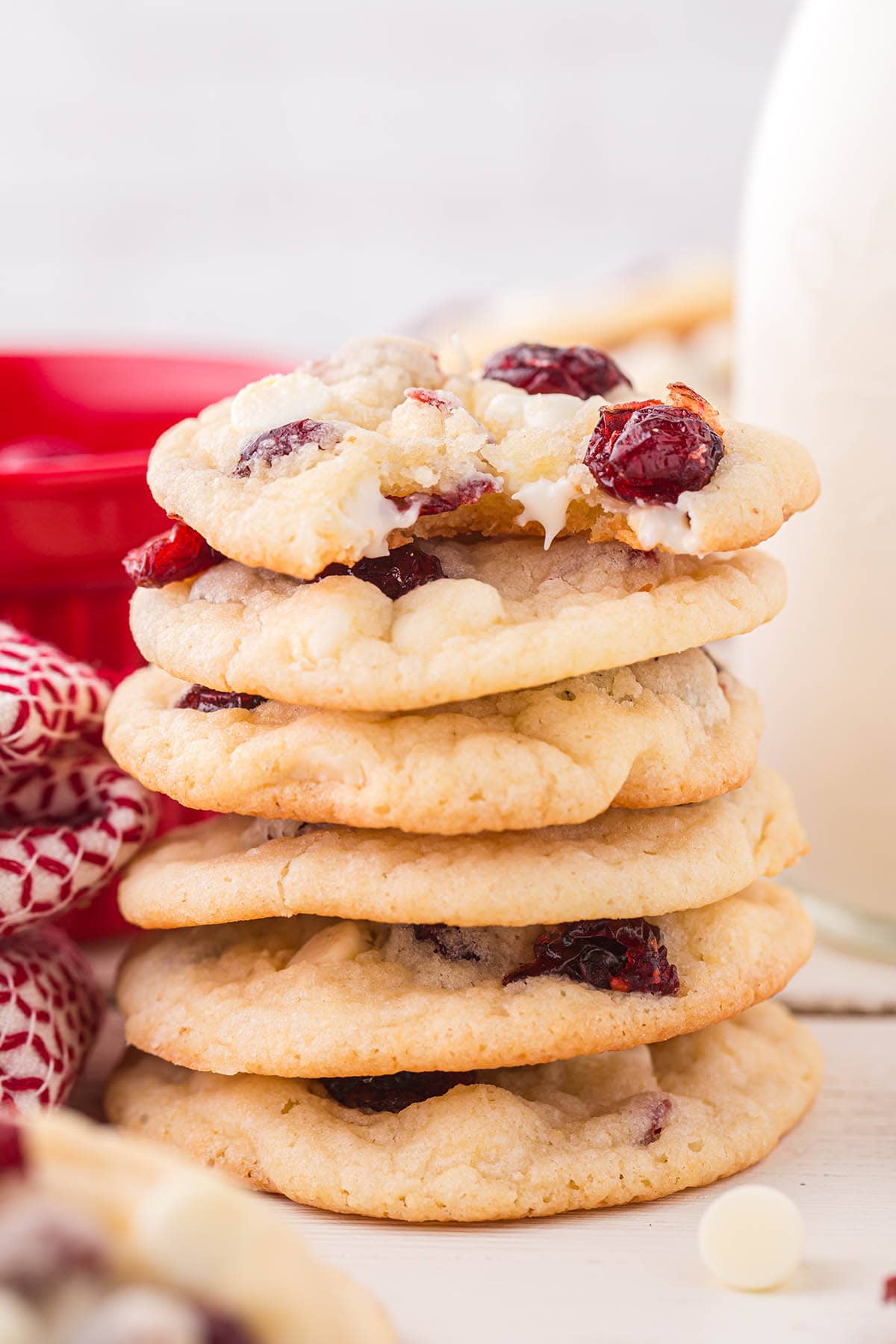 a couple of White Chocolate Cranberry Cookies stacked on top of each other.