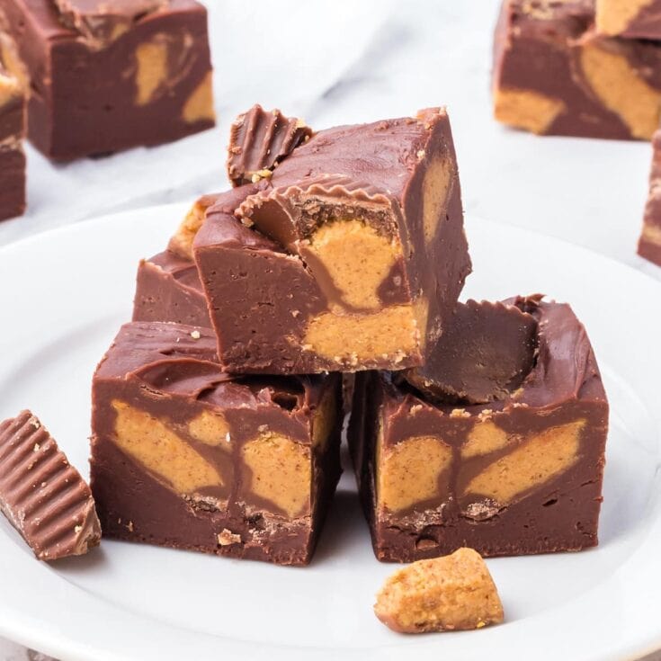 3 small bars of Easy Reeses Fudge on a white plate.