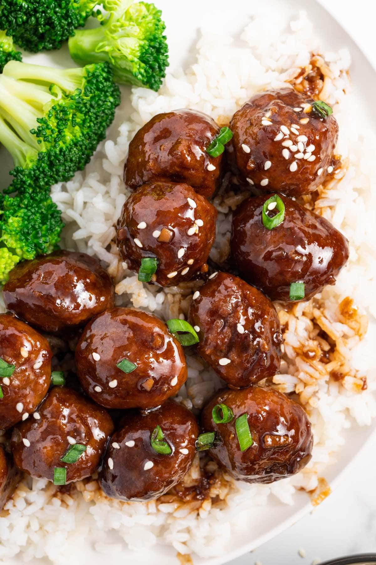 Teriyaki Meatballs over rice with broccoli on the side.