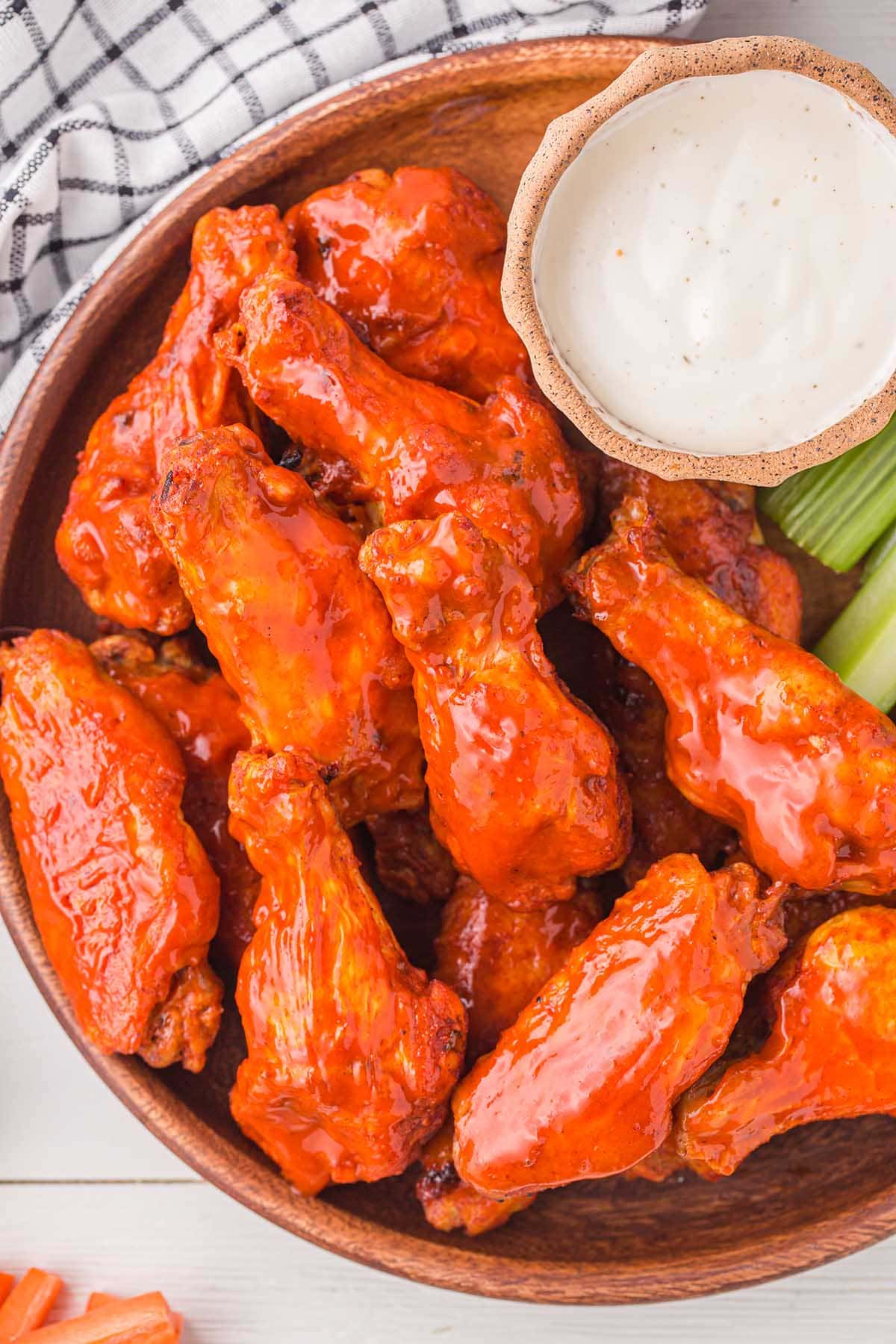 Instant Pot Buffalo Wings served with celery and sauce on the side.