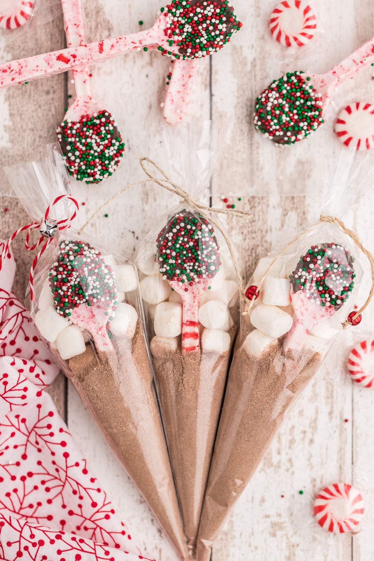 3 gift bags with peppermint candy spoon in each bag.