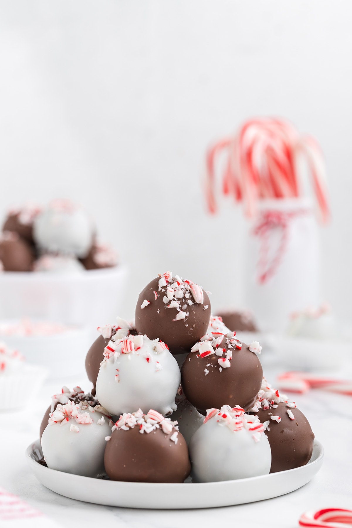 a couple of peppermint truffles stacked on top of plate.