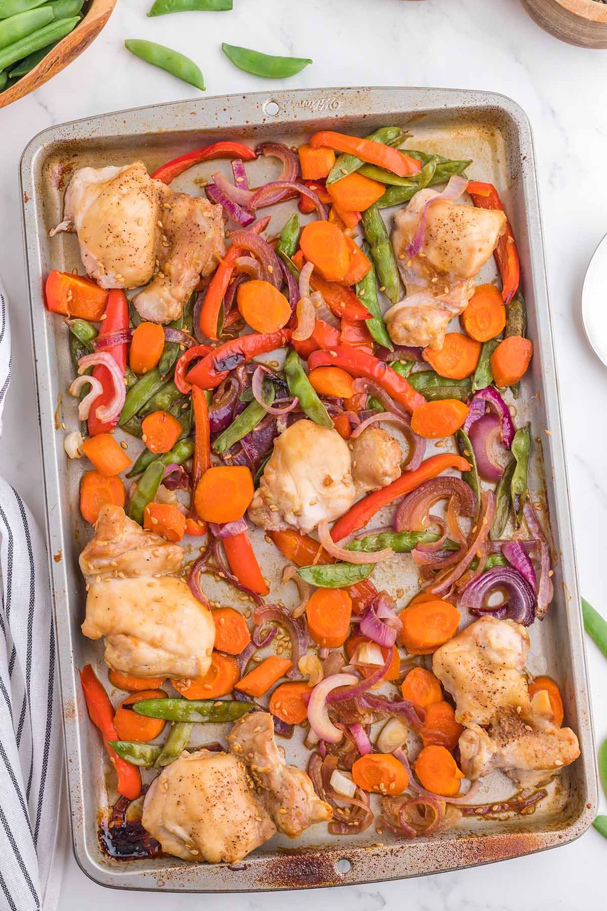 Sheet Pan Asian Chicken on a white table.