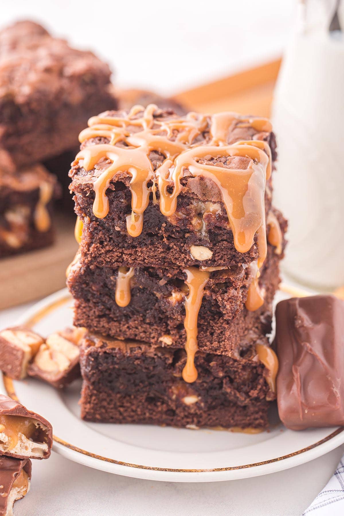 Snickers Brownie drizzled with caramel sauce on top.