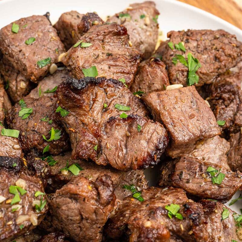 Air Fryer Steak Bites on a white plate.