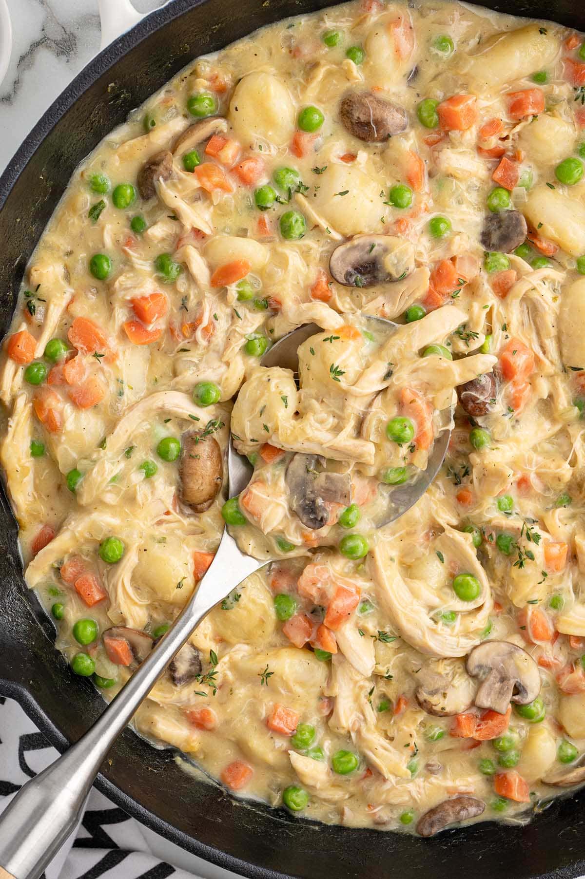 gnocchi chicken pot pie in a skillet. 