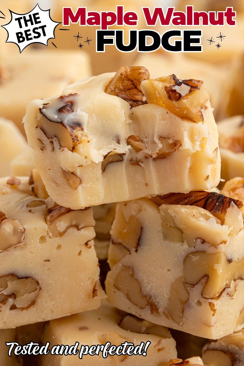 Maple walnut fudge squares stacked with visible walnut pieces.