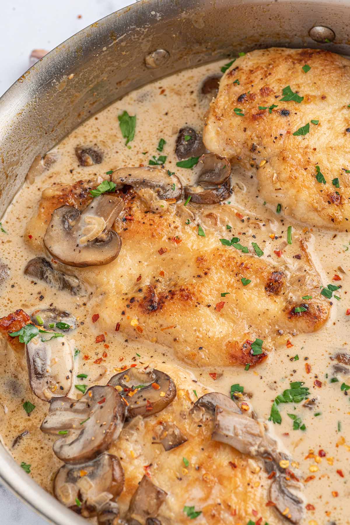 Easy Chicken Marsala garnished with parsley.