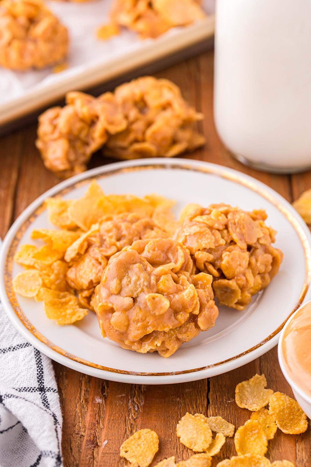 Peanut Butter Cornflake Cookies on a white plate.