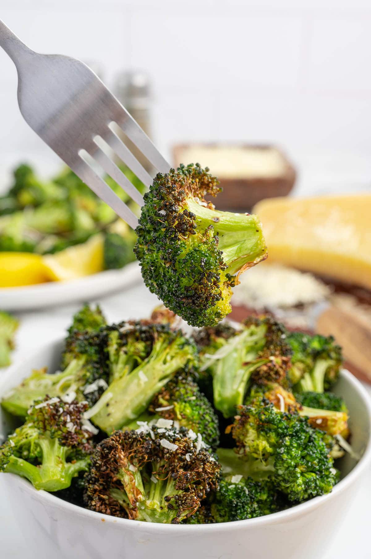 eating Air Fryer Broccoli using fork.