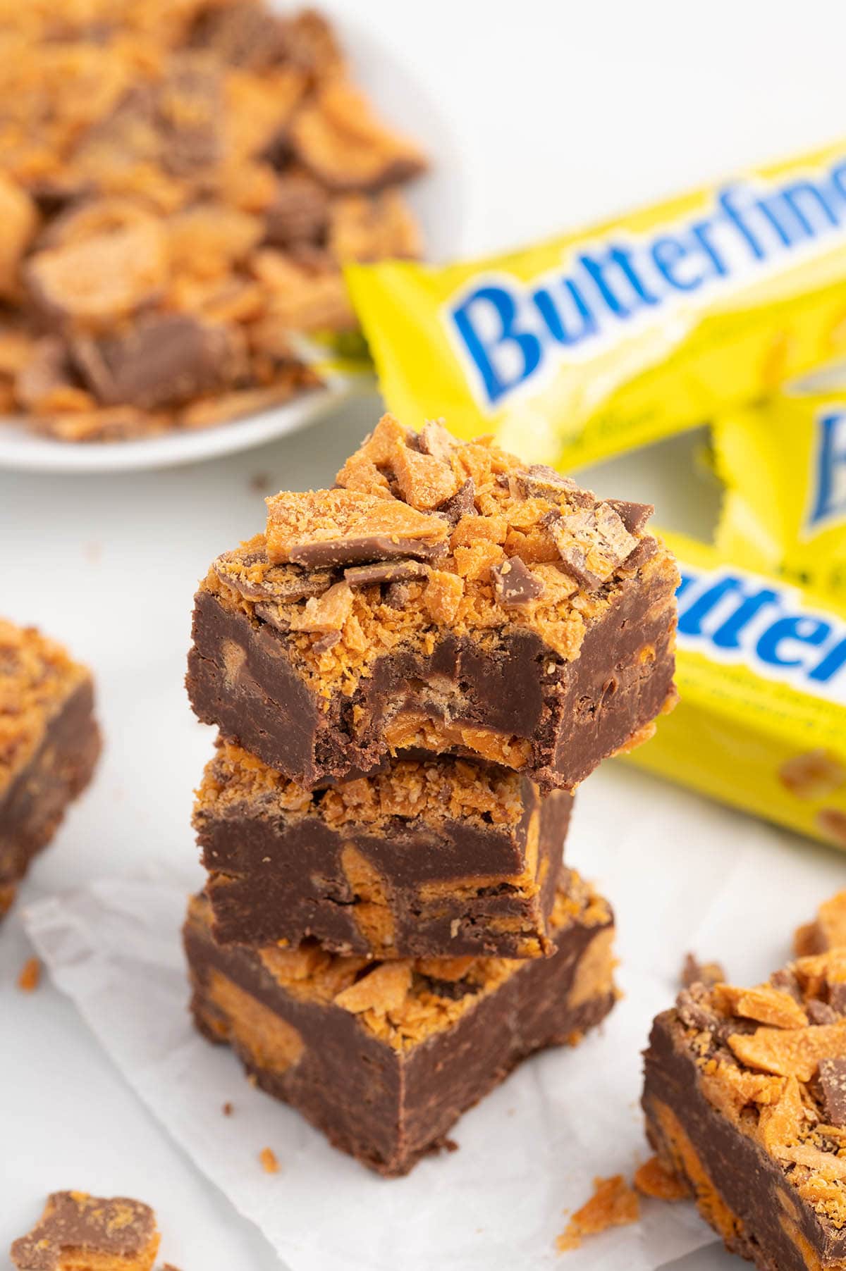 Butterfinger Fudge stacked on the table.