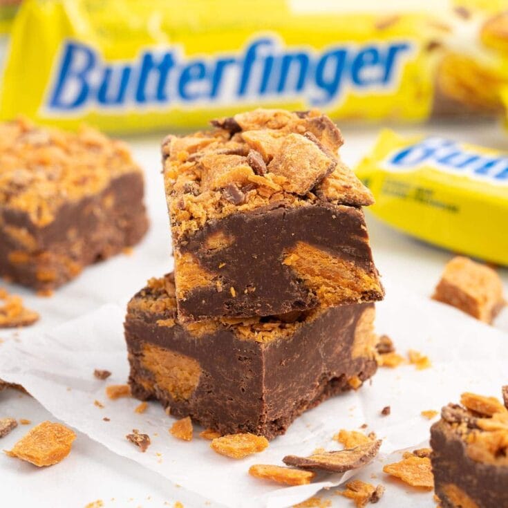 a couple of Butterfinger Fudge on a white table.