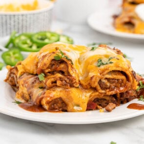 Lazy Enchiladas with a plate of green chilis at the back.