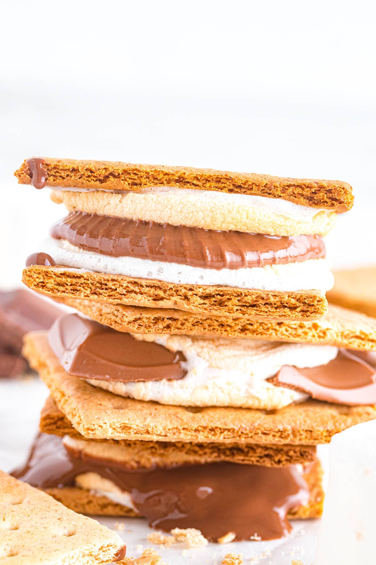2 pieces of air fryer smores with melted chocolate inside.