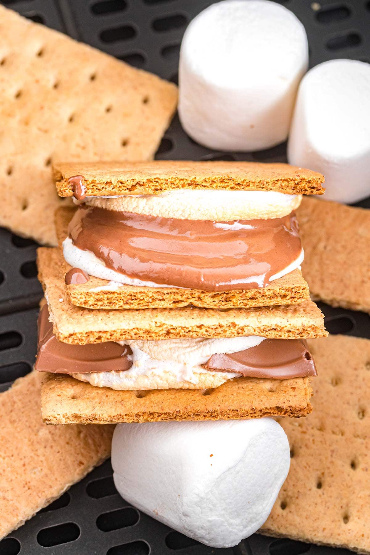 2 pieces of Air Fryer S'mores inside air fryer tray.