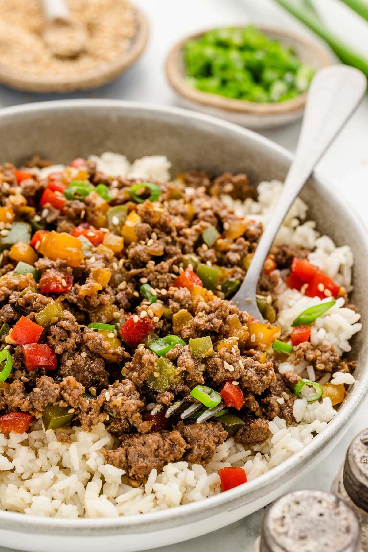 beef and pepper bowl served with rice in a bowl.