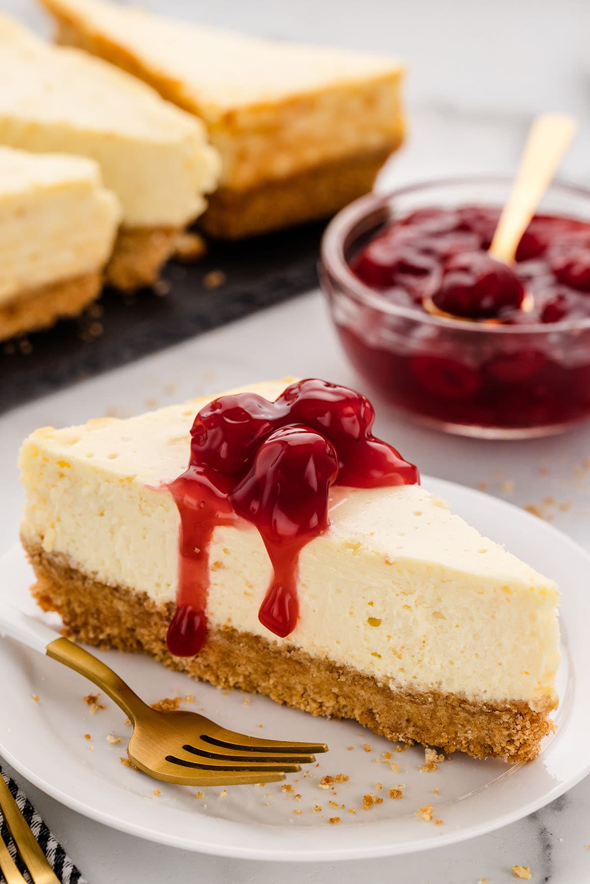 a slice of Loaf Pan Cheesecake on a plate with topping.