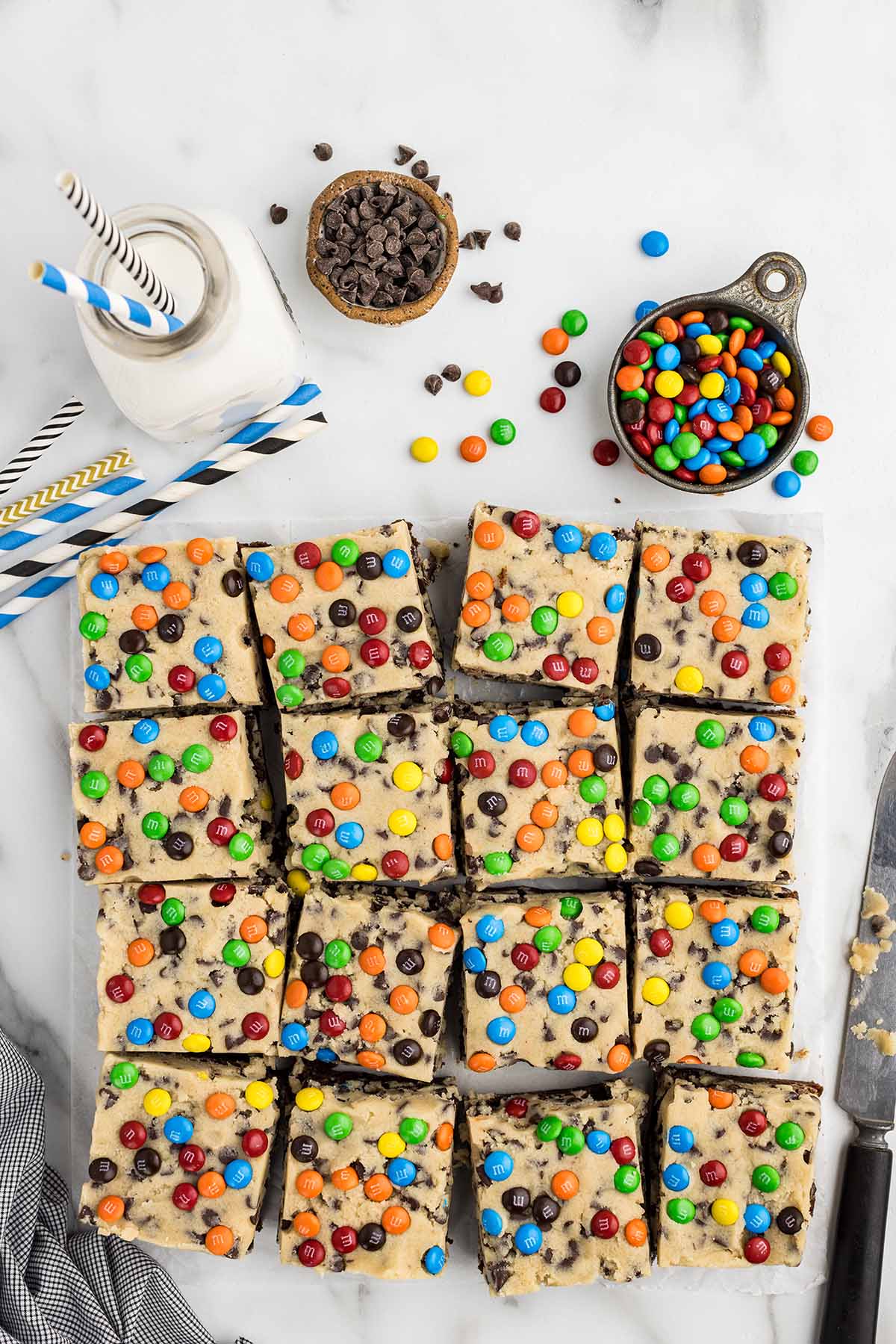 cookie dough brownie cut into a couple of square bars.