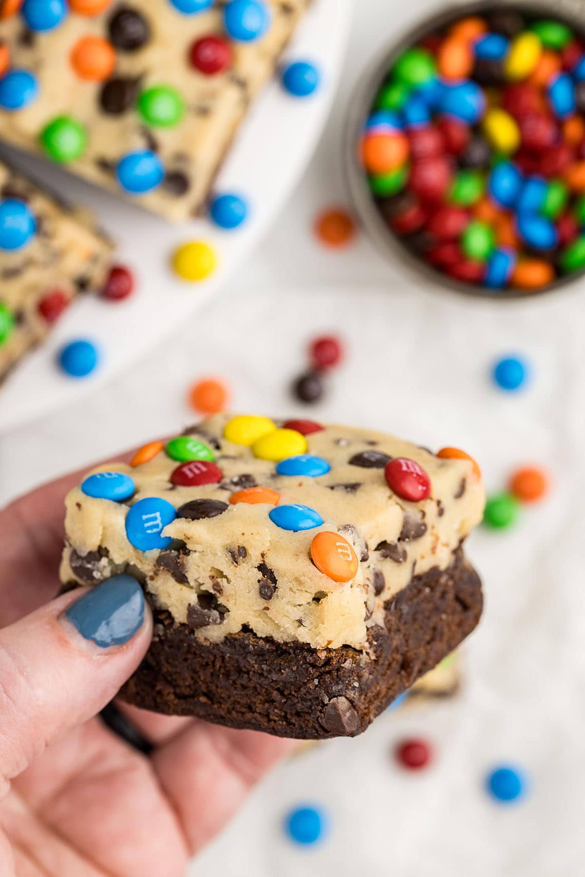 hand holding a Cookie Dough Brownie.