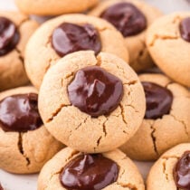 a couple of Peanut Butter Thumbprint Cookies on a plate.