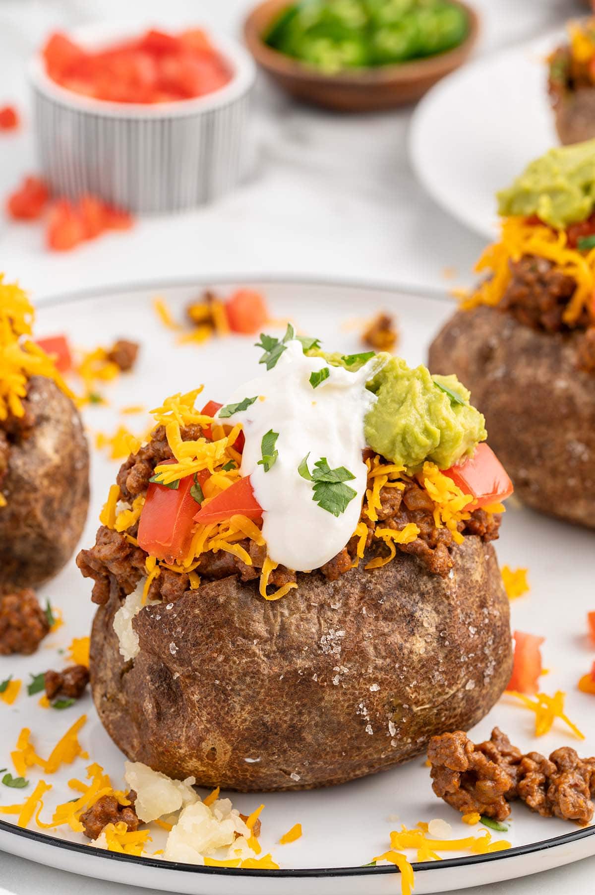 Taco Potatoes with ground beef, cheese, sour cream and guacamole.