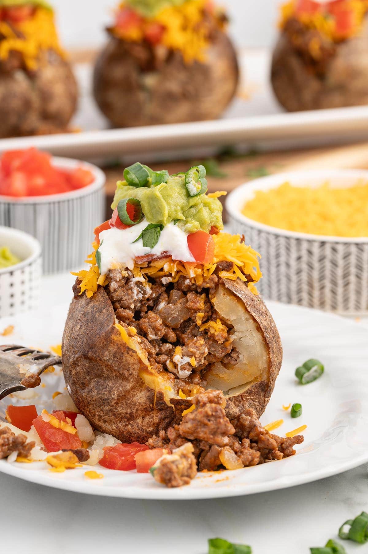 Taco Potatoes stuffed with beef and shredded cheese.