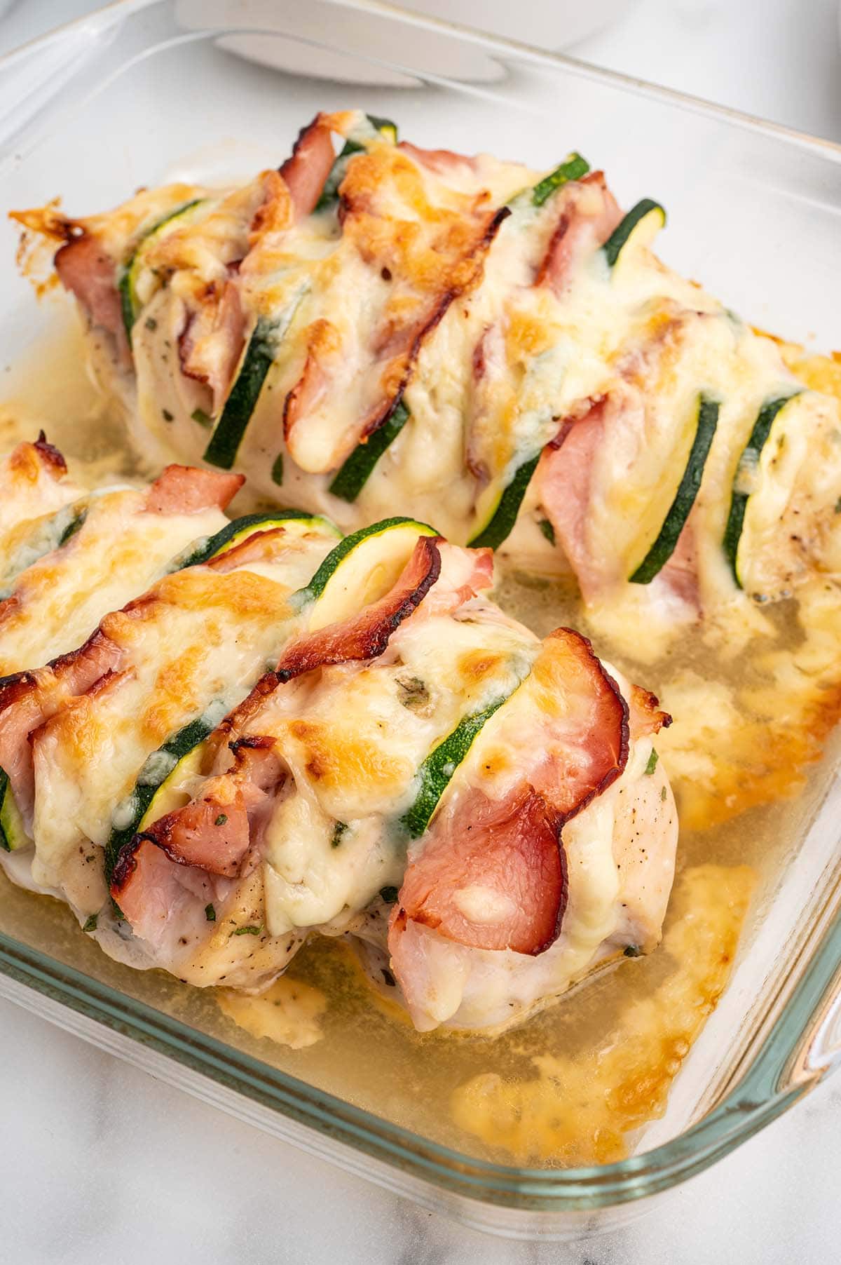 Hasselback Chicken in a baking dish.