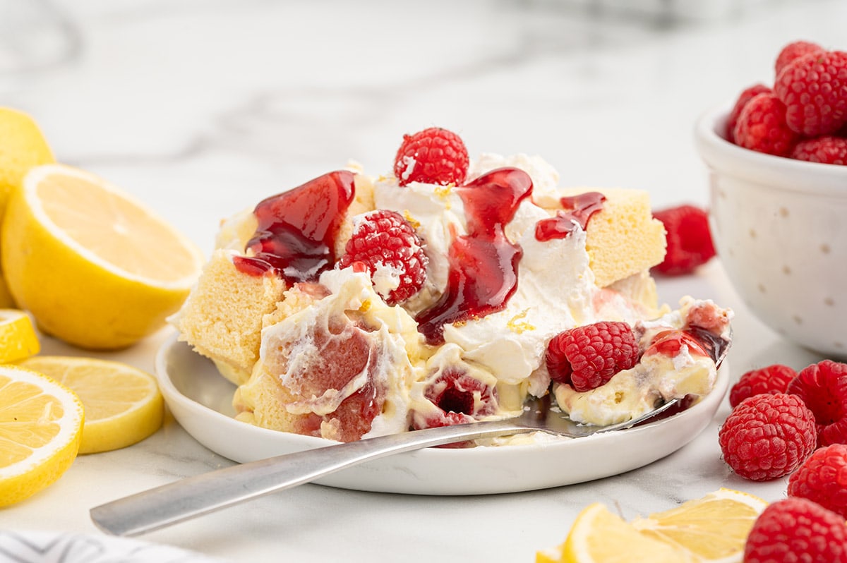 serving Lemon Raspberry Trifle on a white plate.