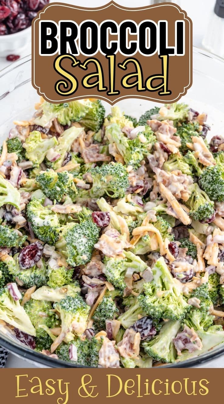 Broccoli Salad mixed with dressing served inside a clear glass bowl.