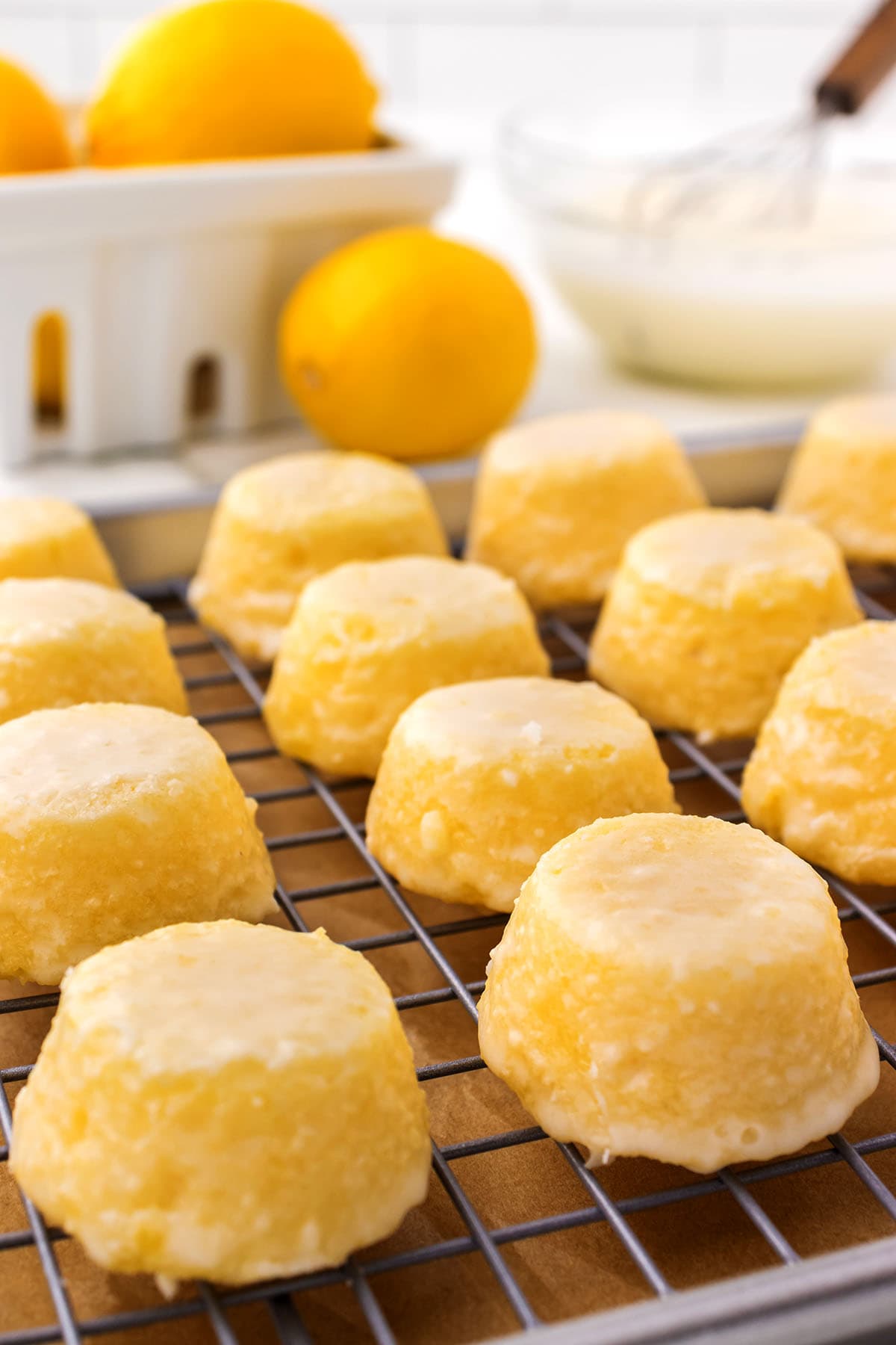 Lemon Drop Cakes on a cooling rack.