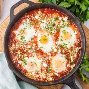 Shakshuka in a skillet and placed on the table.