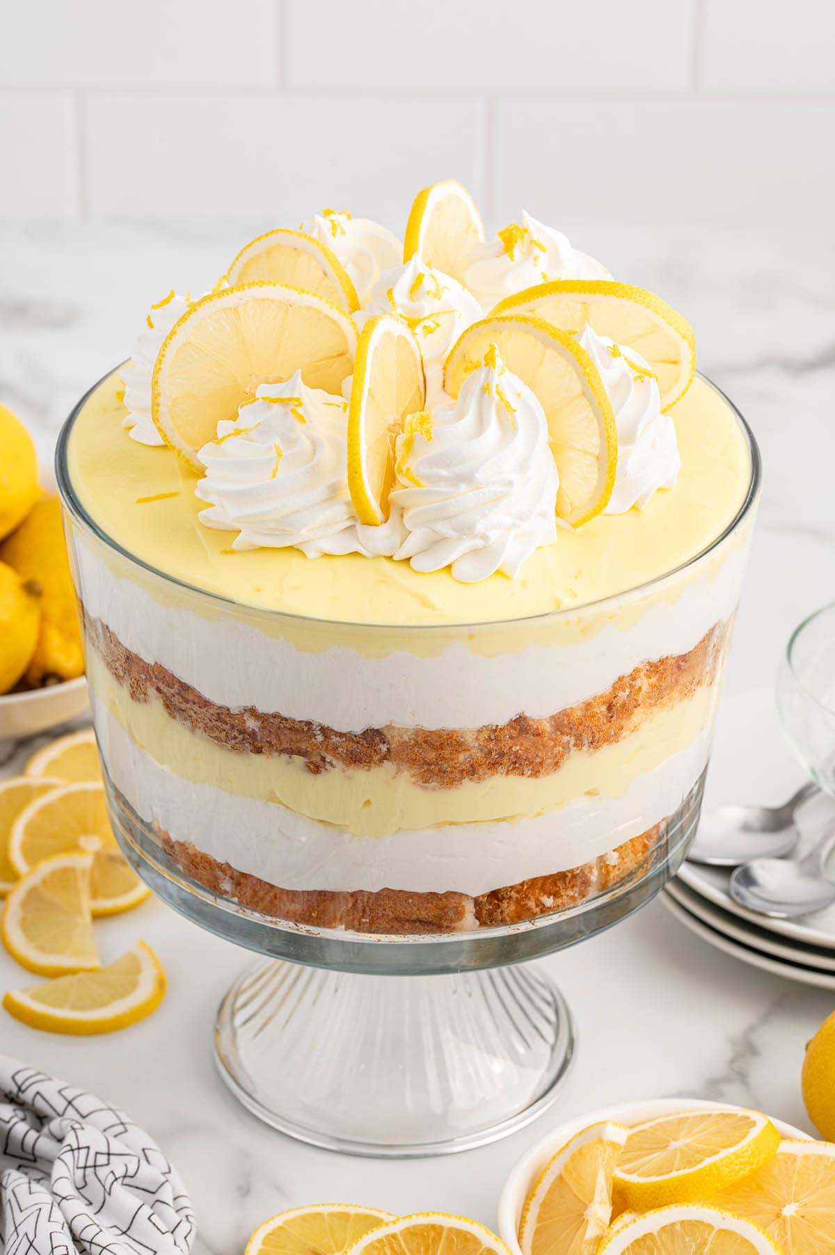 Lemon Trifles with whipped cream and lemon slices on top.