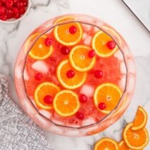 Shirley Temple Punch with orange slices and cherries.