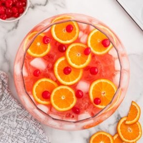 Shirley Temple Punch with orange slices and cherries.
