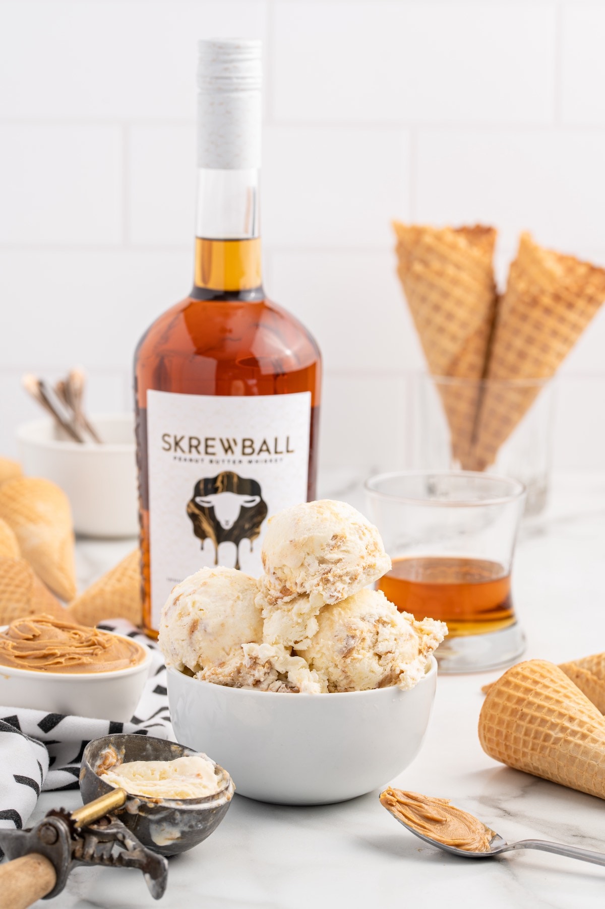 a couple of Skrewball Whiskey Ice Cream in a white bowl.
