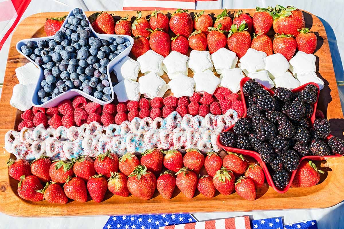 a couple of fresh fruits, mallows and mini pretzels on a 4th of July Fruit and Snack Tray.