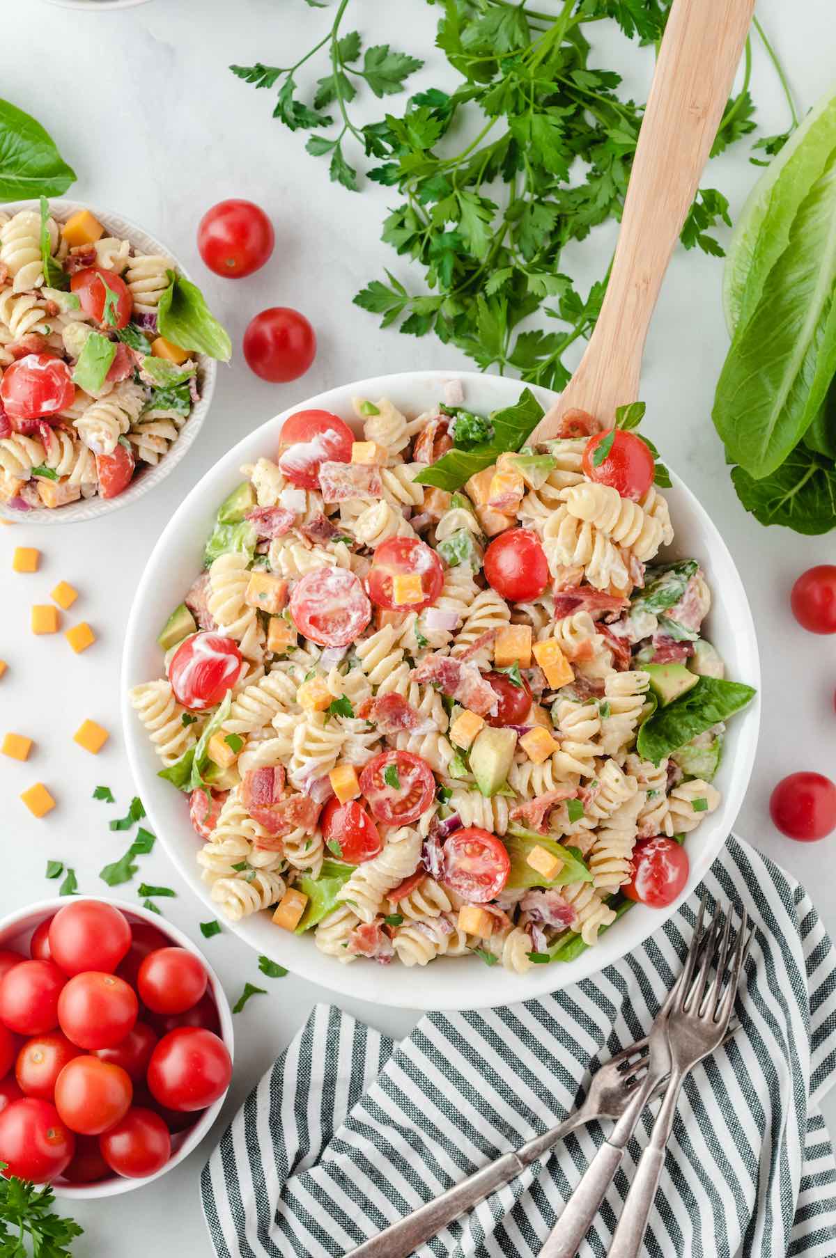 a couple of blt pasta salad in a bowl.